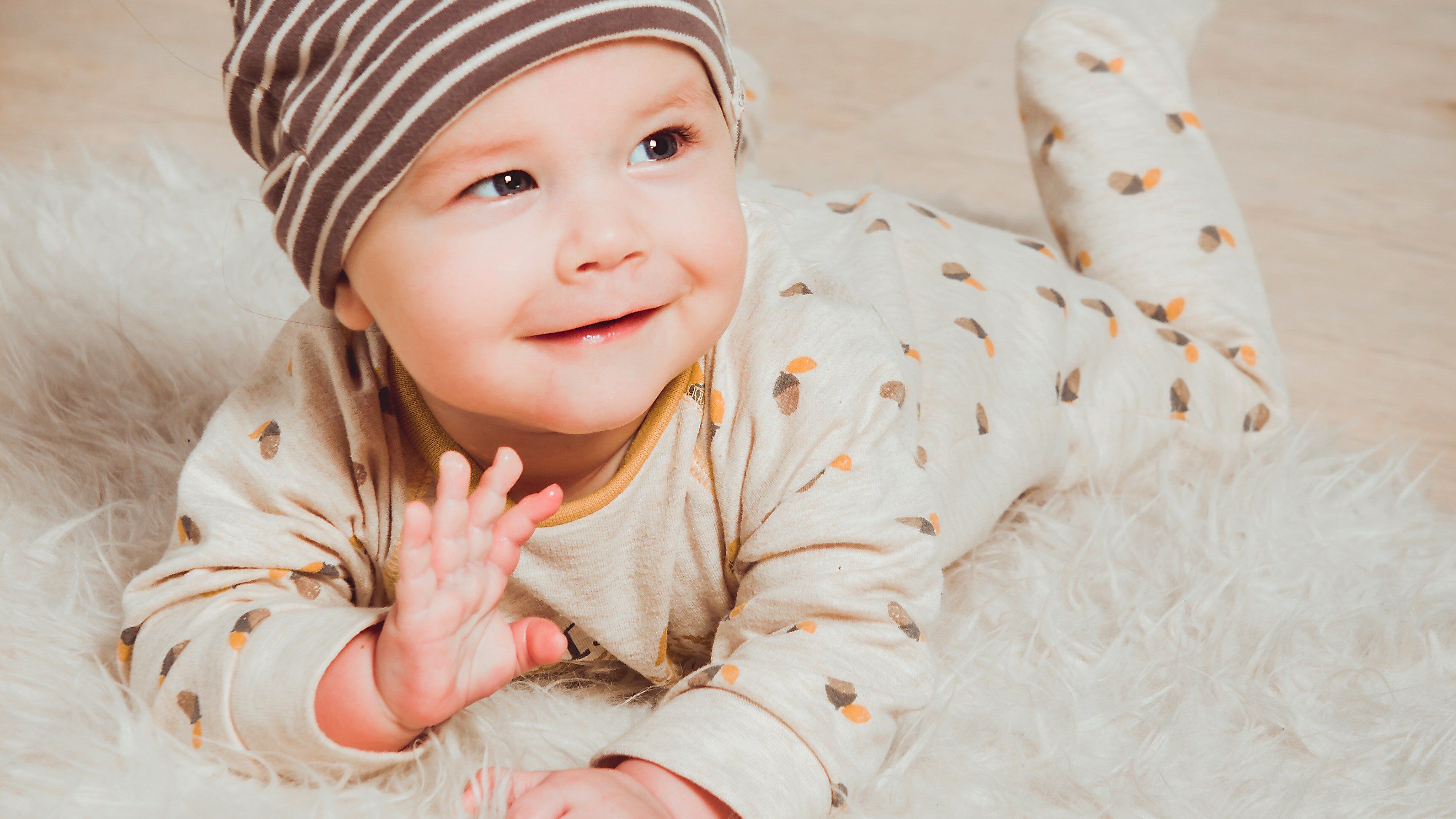 a baby waving a baby waving