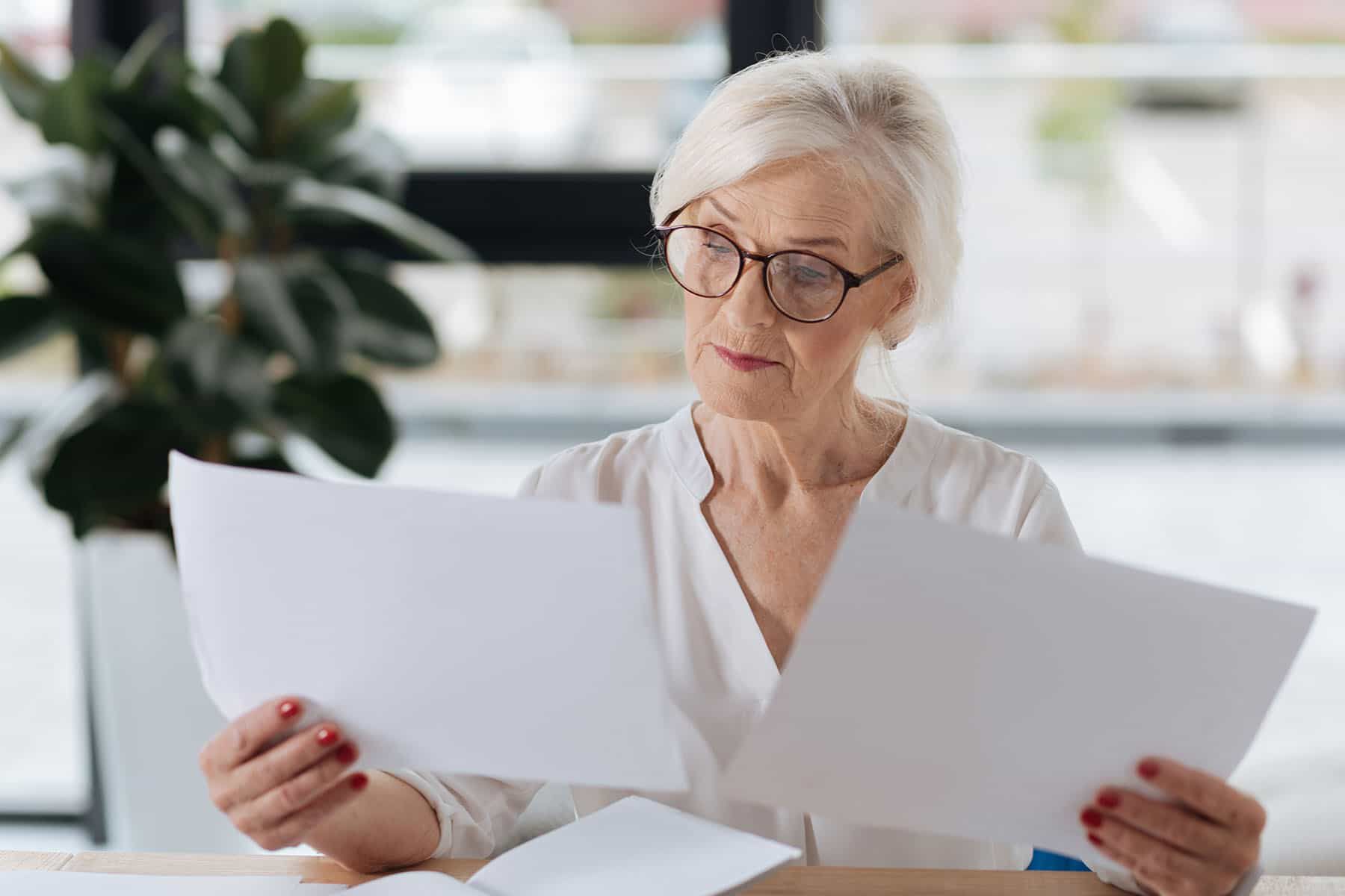 woman reading papers woman reading papers