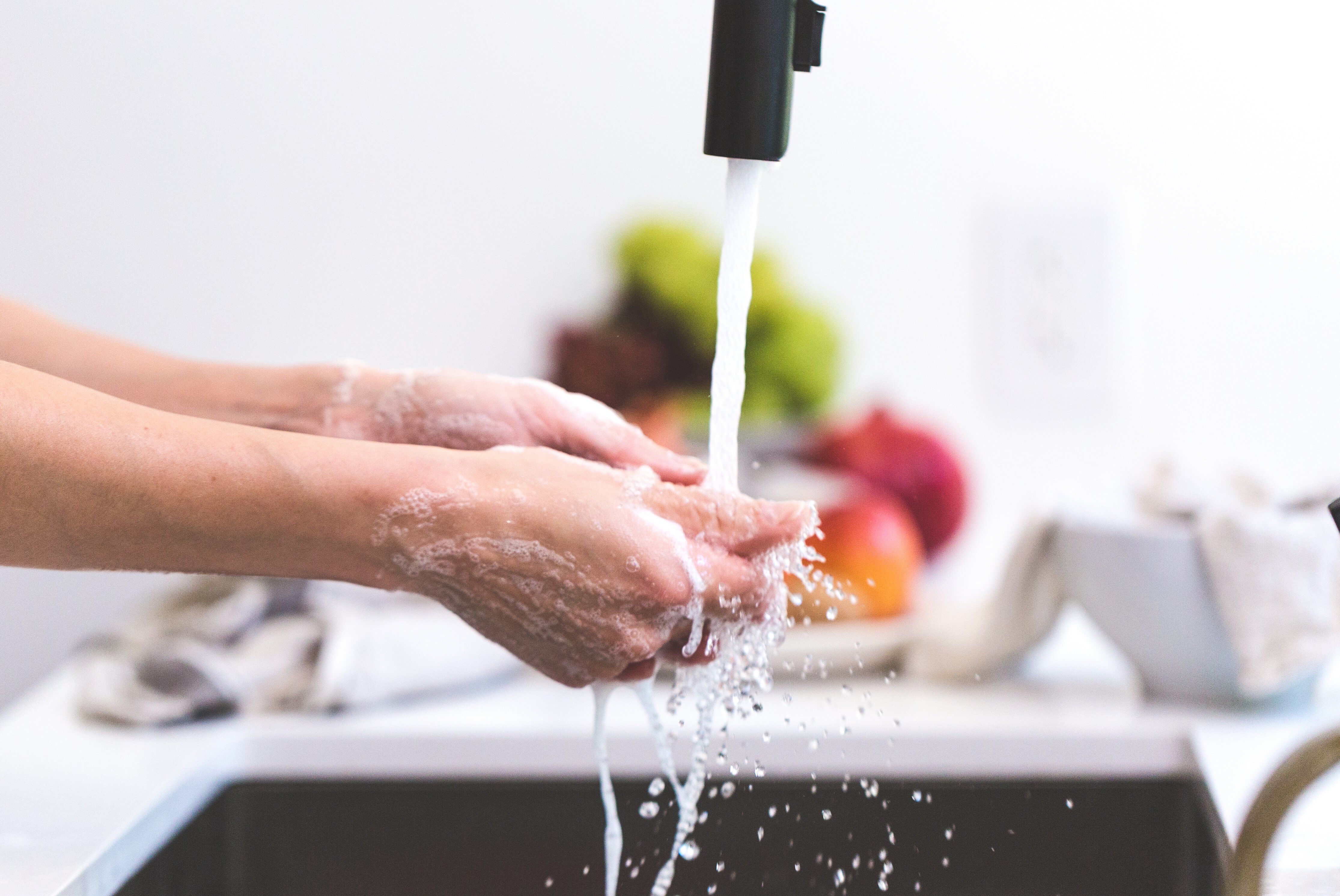 a person washing their hands a person washing their hands
