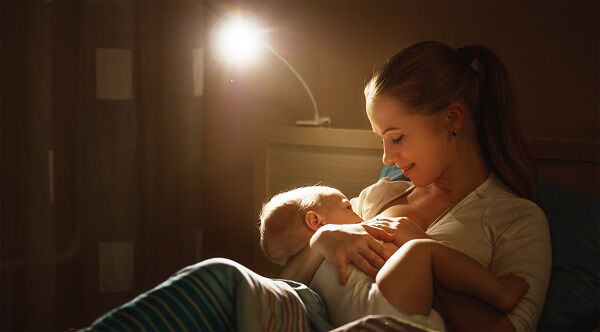 A woman feeding her baby A woman feeding her baby