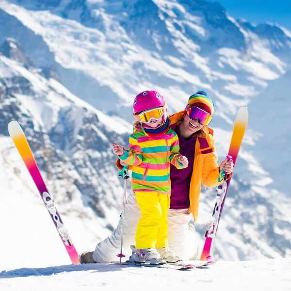 Adult and child skiing Adult and child skiing