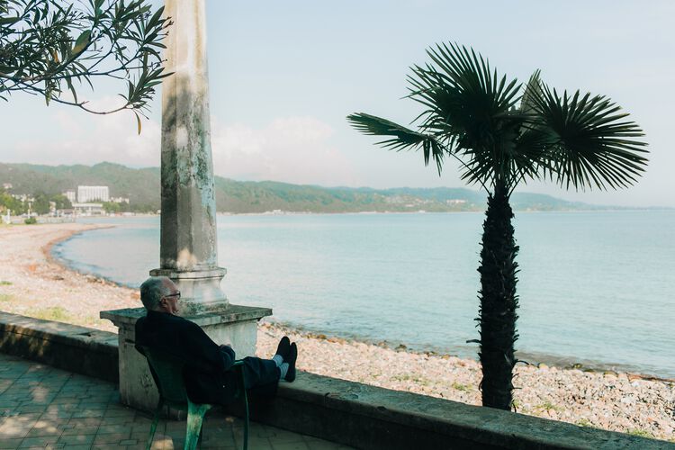 Man sitting by the beach
