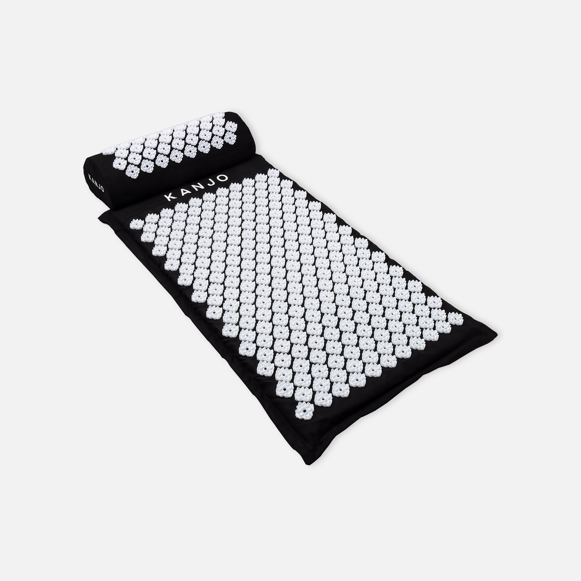 https://fsastore.com/on/demandware.static/-/Sites-hec-master/default/dw442c8d60/images/large/kanjo-memory-acupressure-mat-set-with-pillow-onyx-25586-02.jpg